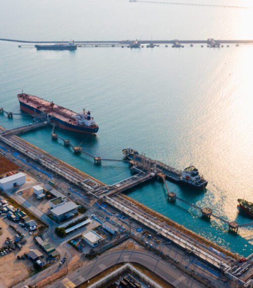 Oil refinery of business logistic sea going ship, the natural gas pipeline for oil delivery ships. to Port of europe-Cargo ship import export, international order concept. Bunkering Service